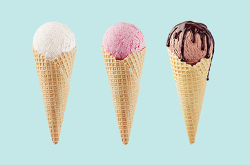 Set of classic flavor ice cream cones in waffle cone - white, pink, brown with chocolate sauce on green background.
