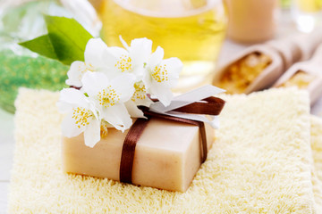 Obraz na płótnie Canvas Bar of handmade soap decorated with jasmine flowers.