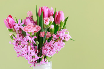 Beautiful bouquet of spring flowers - hyacinths, tulips and carnations.