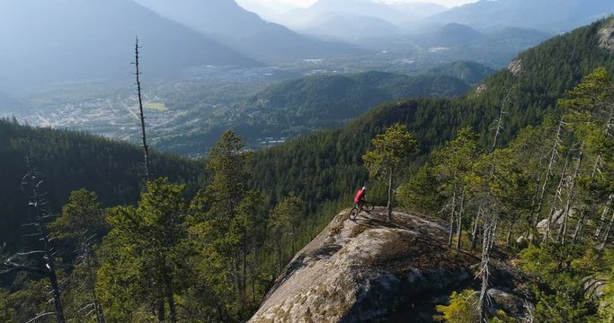 Man Riding Bike On A Trail With Views