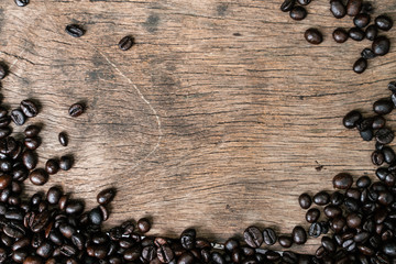 Roast coffee bean on wooden table frame with copy space