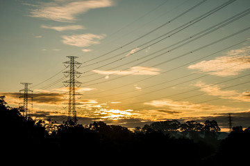 Fototapeta na wymiar High voltage electric post with sunlight in The morning, Chiangmai Thailand