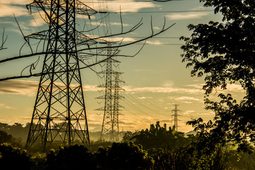 High voltage electric post with sunlight in The morning, Chiangmai Thailand
