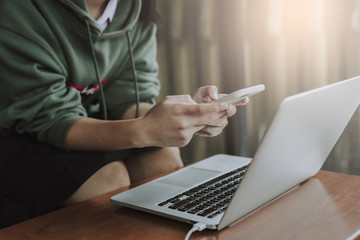 Asian girl teens holding smartphone in coffee shop. © ibravery