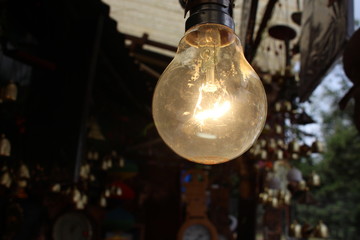  light bulb hanging glowing in dark