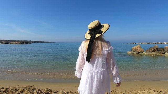 Woman travel to Cyprus and relax near coral bay beach