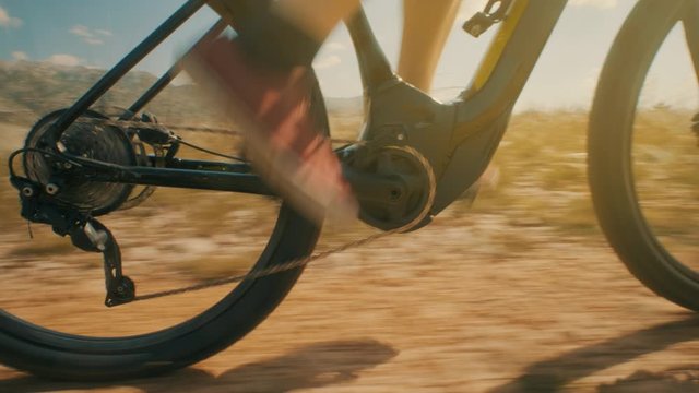 CU of a guy's feet riding a bike