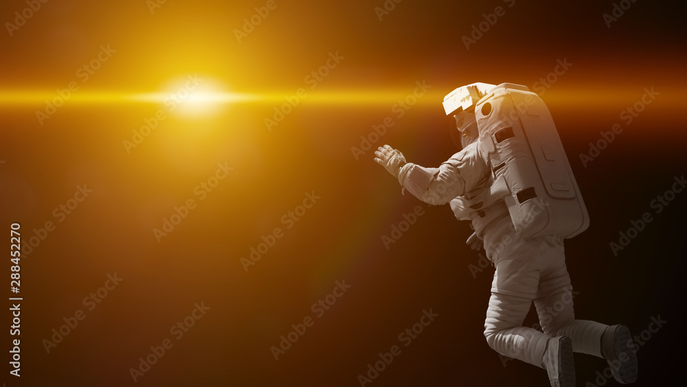 Canvas Prints astronaut in outer space flying towards the sun