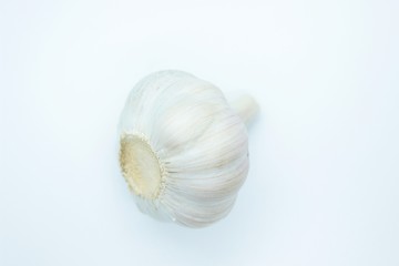 Obraz na płótnie Canvas The head of garlic is located on a white background
