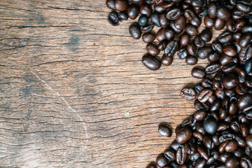 Roast coffee bean on wooden table frame with copy space
