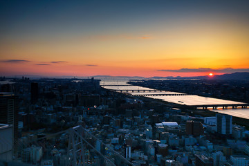 High angle view of Osaka city with Yodo river at sunset time in the Kansai Region from Umeda Sky...