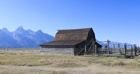 Grand Teton National Park mountain Mormon Row historic house. Pioneer settler homestead farms and ranch. Historic building and scenic landscape.  Over 2.5 million visitors a year. 