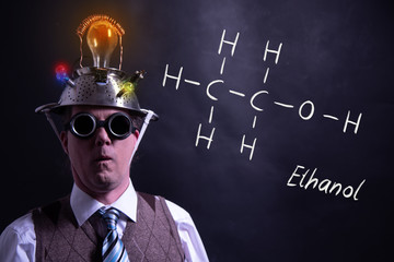 Nerd presenting handdrawn chemical formula of ethanol