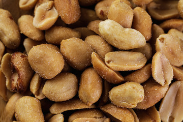 Fototapeta na wymiar the peanuts texture. Nuts. salted peanuts background.