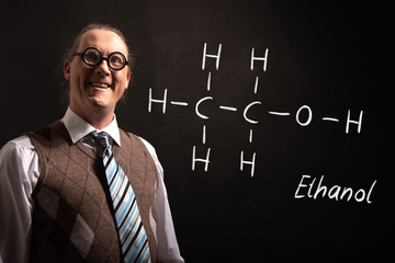 Professor presenting handdrawn chemical formula of ethanol