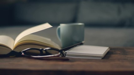 close up opened book in living room  , hobby for relax lifestyle with reading book at home concept