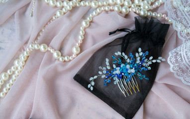 Wedding background with pearls and hair accessories on pink background