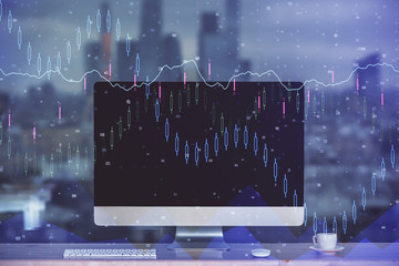 Financial graph colorful drawing and table with computer on background. Multi exposure. Concept of international markets.