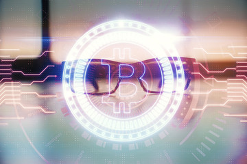 Crypto theme hologram with glasses on the table background. Concept of blockchain. Double exposure.