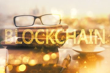 Crypto theme hologram with glasses on the table background. Concept of blockchain. Double exposure.