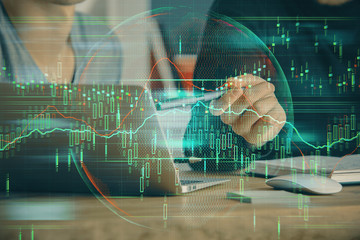 Naklejka na ściany i meble Forex graph with businessman typing on computer in office on background. Concept of analysis. Double exposure.