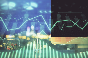 Stock market graph and table with computer background. Multi exposure. Concept of financial analysis.