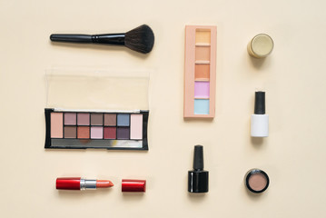 Obraz premium Make up brushes and various cosmetics flat lay background.