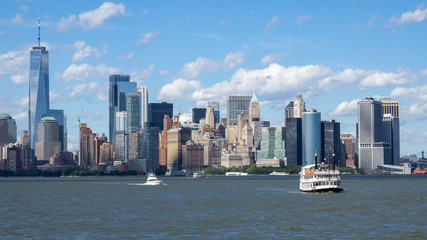 Obraz premium New York, NY, USA. Amazing skyline of Manhattan skyscrapers and buildings from Ellis Island. Landscape inclusive of the Freedom tower - One World Trade Center