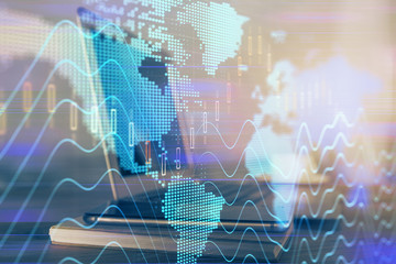 Forex market graph hologram and personal computer on background. Multi exposure. Concept of investment.