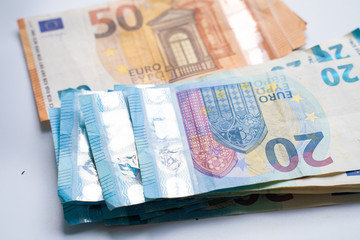 Pile bundle of euro bills money note on white background