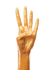 Hands in gold paint. Golden fingers. Female hand is showing numbers isolated on white background. Sign language. Hand numbers