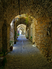 Narrow alley at the medieval castle village of Mesta in Chios island , Greece.