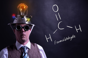 Nerd presenting handdrawn chemical formula of Formaldehyde