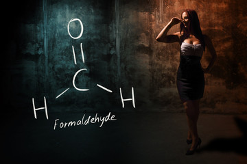 Sexy girl or secretary or female student presenting handdrawn chemical formula of Formaldehyde
