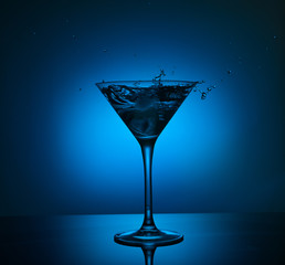 blue martini cocktail with water splash