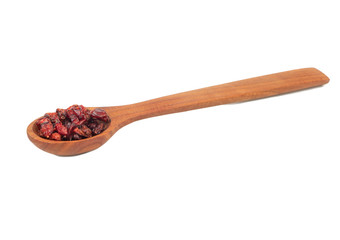 Dry barberry in spoon