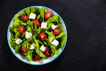 Greek salad on stone background
