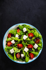 Greek salad on stone background