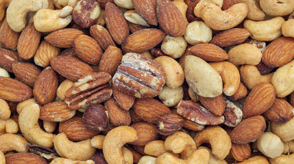 Close up of baked mixed nuts for a background.
