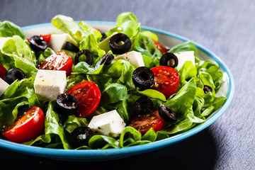 Greek salad on stone background