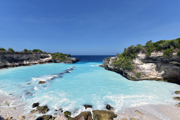 Blue Lagoon Nusa Ceningan is a cove filled with bright turquoise water and  popular spot among thrill seekers looking for cliff jumping