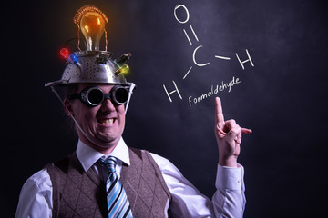Nerd presenting handdrawn chemical formula of Formaldehyde