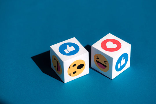 Kyiv, Ukraine - September 5, 2019: A paper cubes with printed emojis from Facebook Messenger, one of the biggest and world-famous social network.