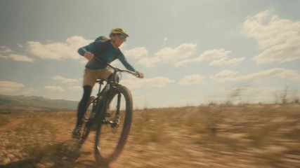 A guy cycling and having fun on his E-bike