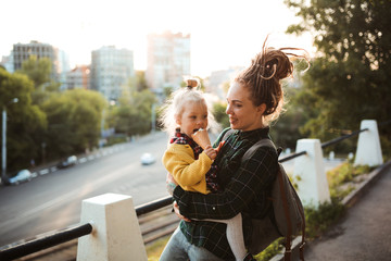 mom with dreadlocks and toddler eating ice cream