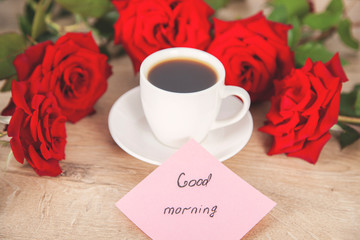 good morning text on card with coffee and roses