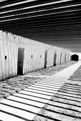 Abstract striped shadow against on wall of ancient fort.