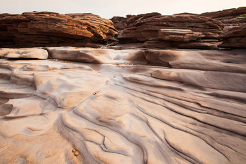 Abstract ripples of sedimentary sandstone.
