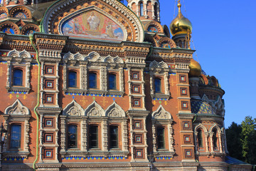 Fototapeta na wymiar Church facade architecture details of Church of Our Savior on Spilled Blood in Saint Petersburg city, Russia. Religious ornamental building exterior close up view on sunny day