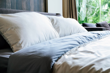 Modern white bed and pillow in the morning mood